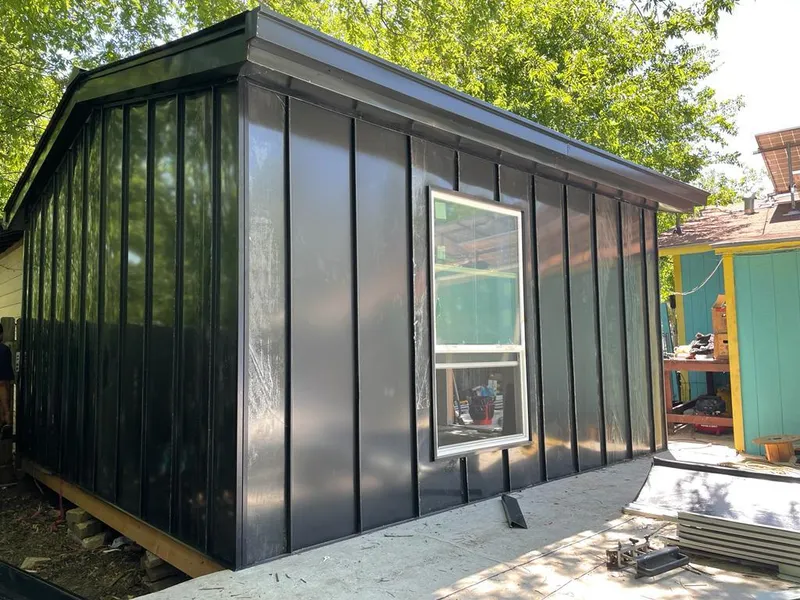 Black standing seam metal wall panels for Roof Inspection in The Dalles