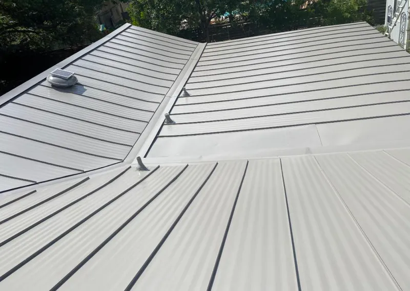 Solar attic fan installed on a metal roof for Roof Ventilation in The Dalles